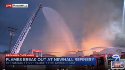 Firefighters battle the three-alarm blaze that destroyed the Newhall Refinery restaurant and spread along a block of Main Street in Old Town Newhall on Monday, Aug. 24, 2026. Screenshot courtesy of ABC7.