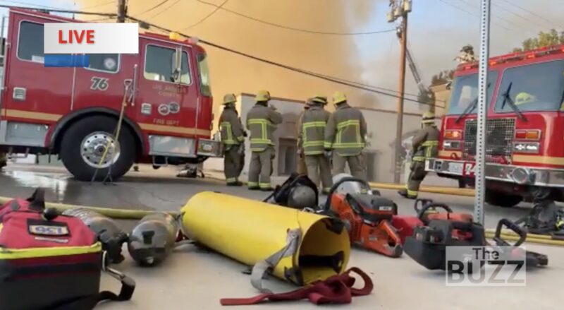 Firefighters continue to battle the blaze that started in the early-morning hours of Monday, Aug. 24, 2026. Screenshot from The Buzz, The Signal's live streaming network.