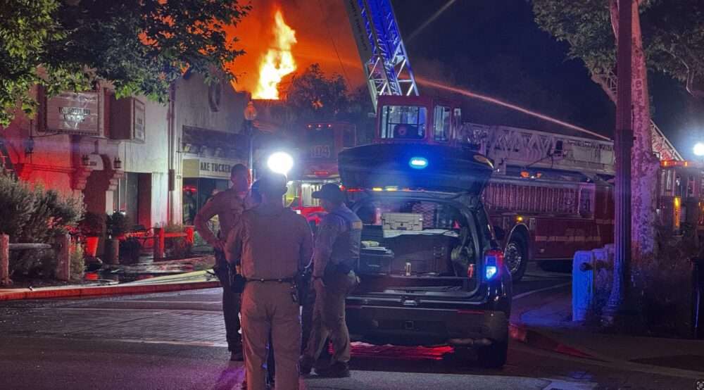Firefighters battle the blaze that broke out at The Newhall Refinery restaurant on Main Street in the early hours of Monday, Aug. 24, 2026. Signal staff photo.