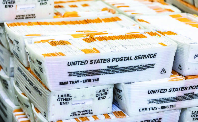 Voting ballots move forward in an audit process at the Orange County Registrars office in Santa Ana, Calif., on June 9, 2022. Photo by John Fredricks.