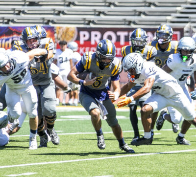 Canyons quarterback River Warren (6) carries the ball during the second quarter of Saturday's game against El Camino at College of the Canyons on Sept. 5, 2026. Habeba Mostafa/ The Signal