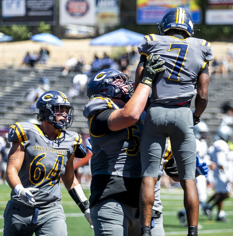 Canyons wide receiver Donovan Glover (7) celebrates with teammates during the second quarter of Saturday's game against El Camino at College of the Canyons on Sept. 5, 2026. Habeba Mostafa/ The Signal