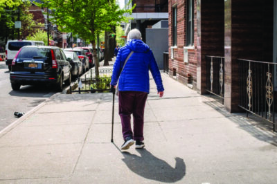 An elderly woman walks on a street in New York City on April 29, 2026. Photo by Samira Bouaou.