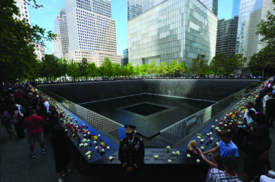Visitors gather at the reflecting pools on the 25th anniversary of the 9/11 terrorist attacks on the World Trade Center, at the National 9/11 Memorial & Museum in New York City on Sept. 11, 2026. Adam Gray - Pool/Getty Images