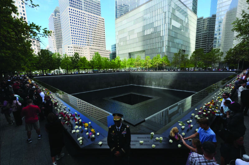 Visitors gather at the reflecting pools on the 25th anniversary of the 9/11 terrorist attacks on the World Trade Center, at the National 9/11 Memorial & Museum in New York City on Sept. 11, 2026. Adam Gray - Pool/Getty Images