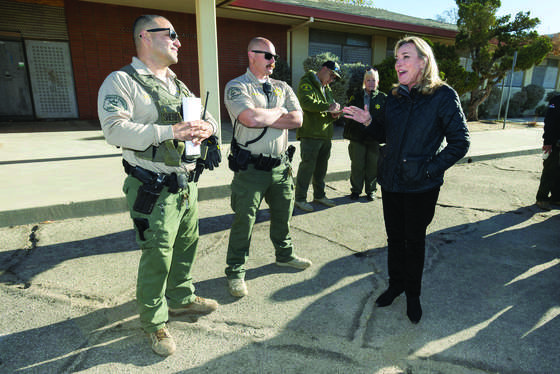 Los Angeles County Supervisor Kathryn Barger speaks with Los Angeles County Sheriff's Department Homeless Outreach Services Team (HOST) deputies before a homeless encampment operation in the Antelope Valley in November 2024. (Photo credit: Diandra Jay/Los Angeles County)
