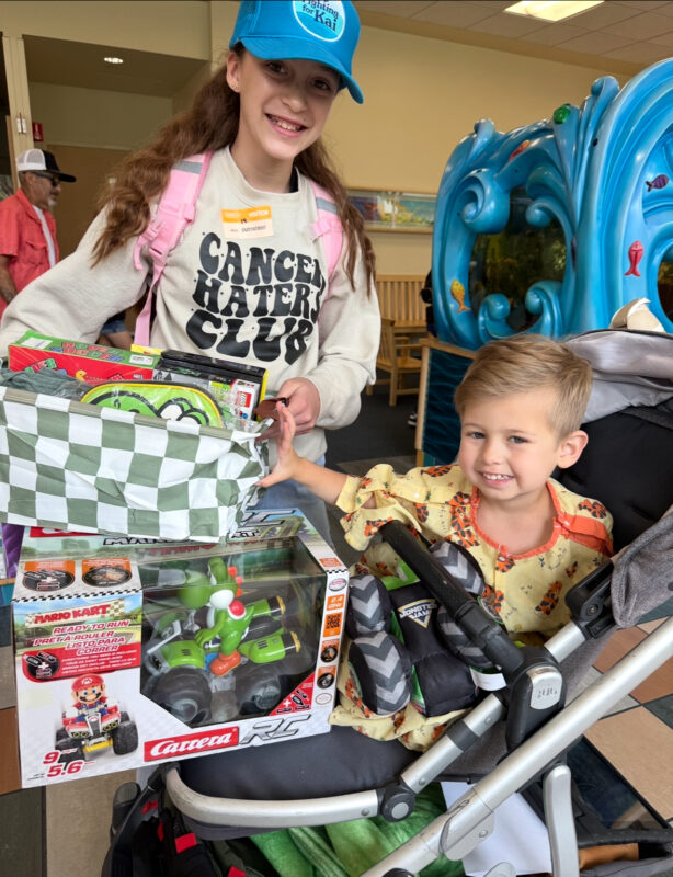 Brooklyn Hernandez, 12, and a child that received Hot Wheels from her. Photo courtesy of Tiffany Hernandez.