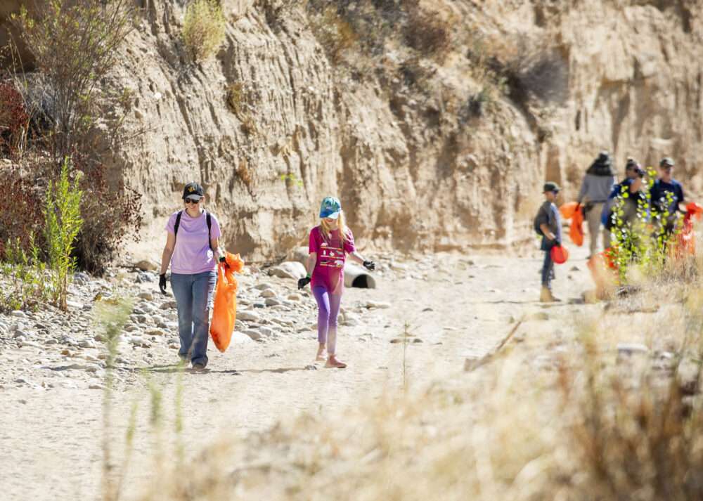 Attendees pick up trash in the riverbed during the 31st Annual River Rally Clean-Up and Environmental Expo. at Newhall Community Center on Saturday, Sept. 19, 2026. Habeba Mostafa/ The Signal