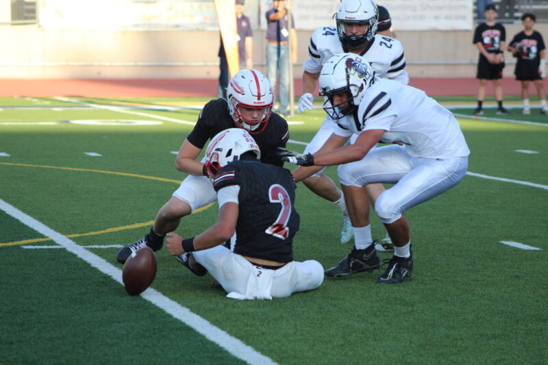 Trinity and Santa Clarita Christian players scrambling for the fumble uring a Heritage League game at College of the Canyon’s Cougar Stadium on Sept. 19, 2026. Ryan Romero/The Signal