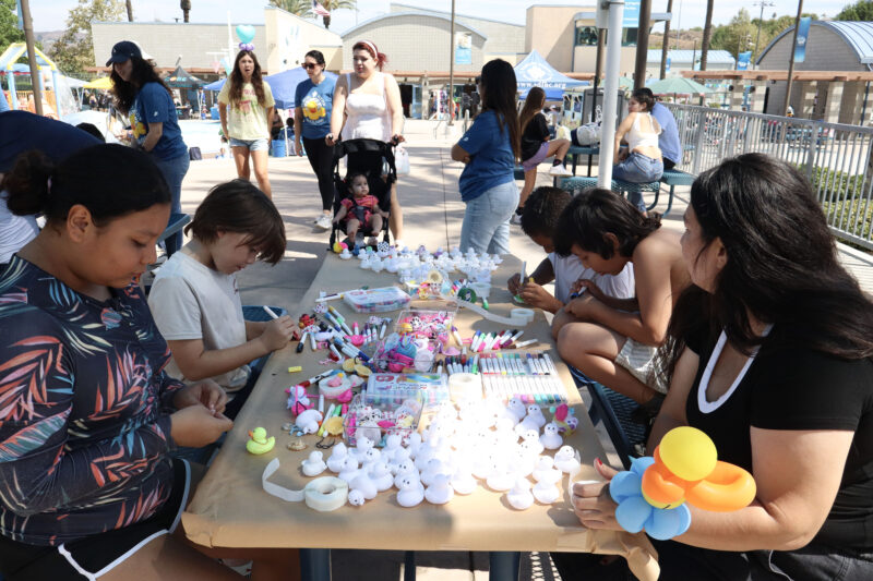 Attendees decorate rubber ducks at the Samuel Dixon Family Health Center's 23rd annual "Duck Dash" at the Santa Clarita Aquatic Center in Santa Clarita, Calif., Sunday, Sept. 20, 2026. Kamryn Martell/The Signal