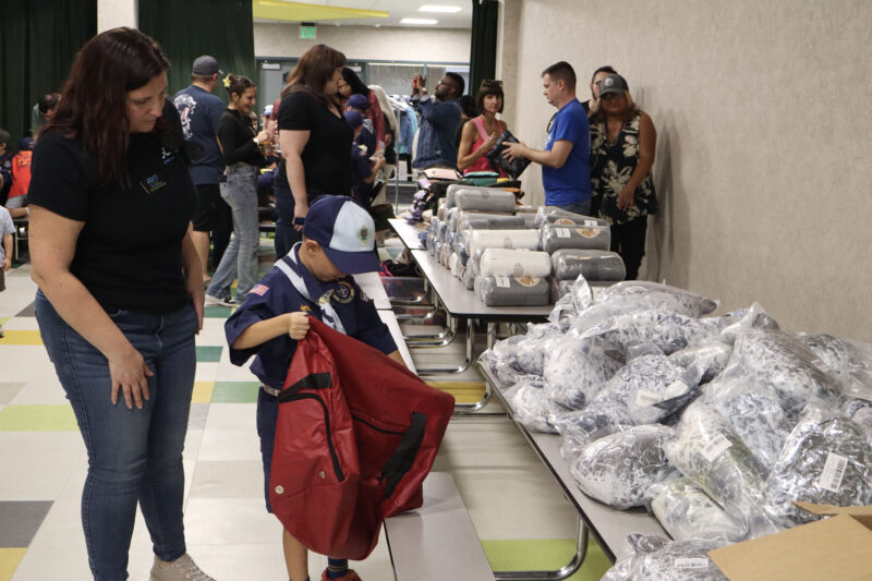 Kari McCoy and Preston McCoy, 8, put supplies in a bag at Junior Chamber International Santa Clarita's inaugural "Carry Hope" project at North Park Elementary School in Valencia, Calif., Wednesday, Sept. 16, 2026. Kamryn Martell/The Signal