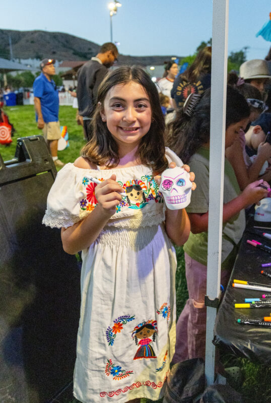 A girl shows off her sugar skull at the final "Celebrate" event highlighting Mexico at Canyon Country Community Center, Thursday, Sept. 10, 2026. Chloe Miller/For The Signal