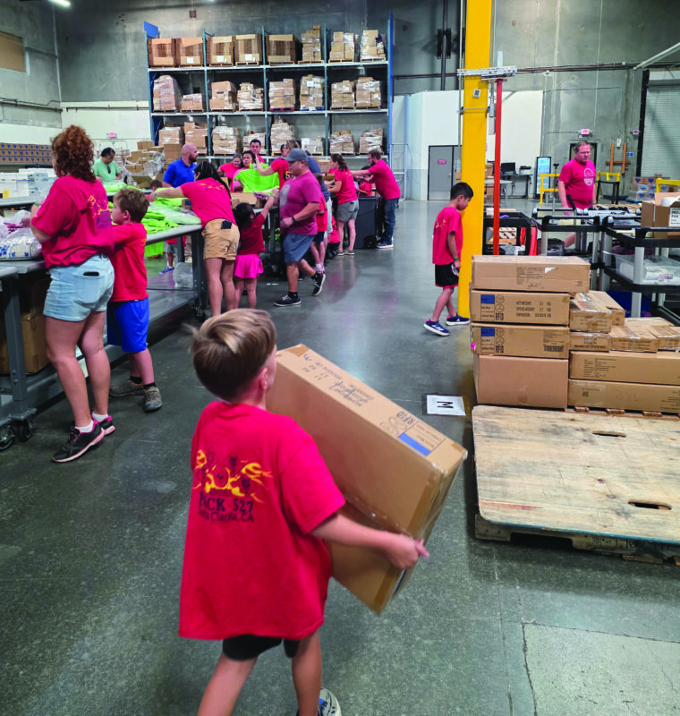 Cub Scouts from Pack 527 recently volunteered alongside their parents with The Children’s Hunger Project. Courtesy photo.