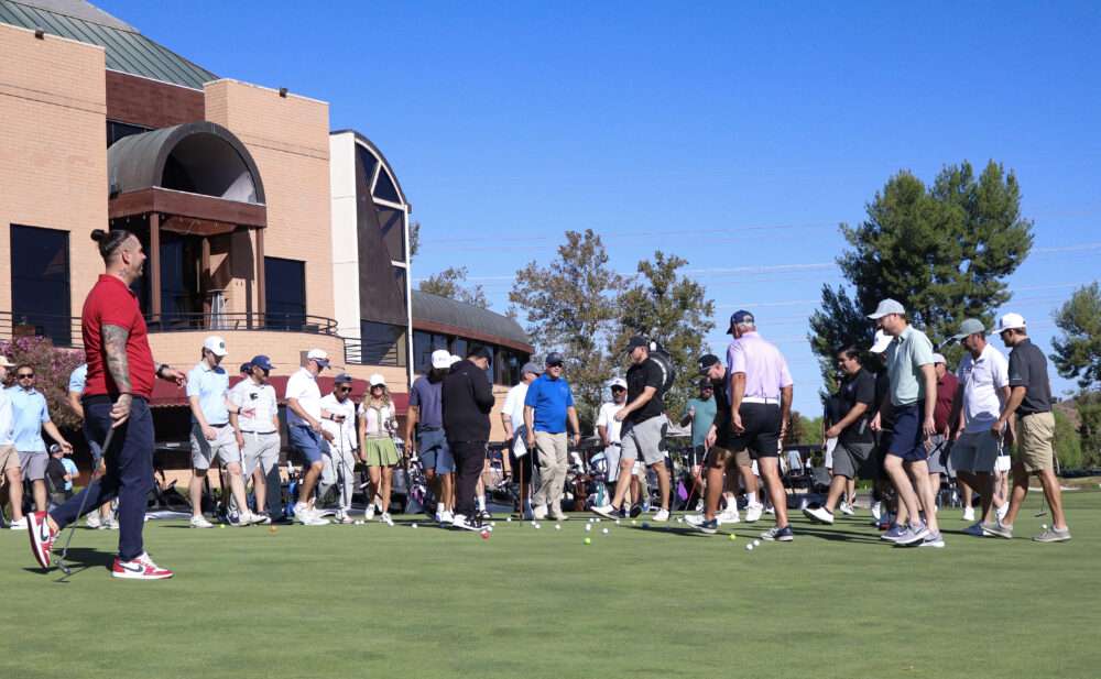 Attendees grab their golf balls after the mega-putt contest at the Chamber of Commerce's 42nd annual "Oak Tree Golf Classic" at Valencia Country Club in Valencia, Calif., Monday, Sept. 28, 2026. Kamryn Martell/The Signal