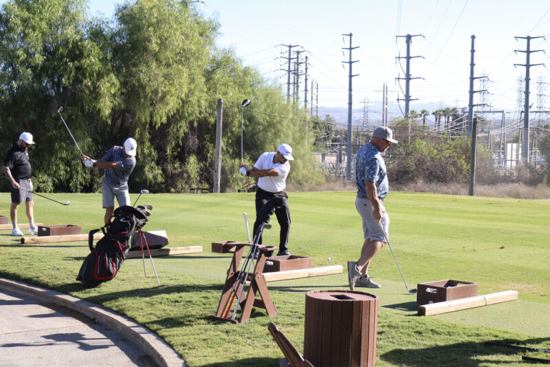 Attendees practice during the chipping contest at the Chamber of Commerce's 42nd annual "Oak Tree Golf Classic" at Valencia Country Club in Valencia, Calif., Monday, Sept. 28, 2026. Kamryn Martell/The Signal