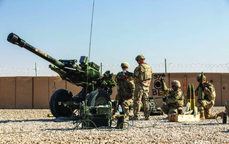 U.S. Soldiers with 2nd Platoon, Bravo Battery, 2-15 Field Artillery, 2nd Brigade Combat Team, 10th Mountain Division conduct an artillery live fire exercise at Al Asad Air Base, Iraq, on Dec. 1, 2023. U.S. Army photo by Staff Sgt. Quince Lanford/Public Domain