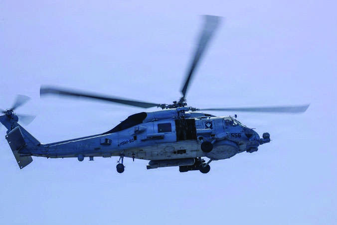 An MH-60R Sea Hawk helicopter, assigned to Helicopter Maritime Strike Squadron 50, takes off from the flight deck of the Arleigh Burke-class guided-missile destroyer USS Thomas Hudner on May 4, 2026. US NAVY/AFP via Getty Images