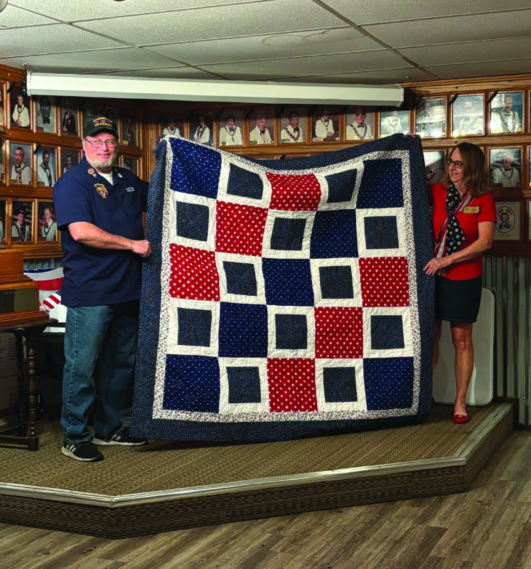 Santa Clarita Elks Lodge No. 2379 recently honored Larry Finley (left) with a quilt from the national nonprofit Quilt of Valor Foundation, represented by Donna Kiger (right). Courtesy photo.