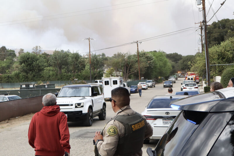 Residents in the area get ready per evacuation warnings of the "Bike Fire" on the 16400 block of Cambria Estates Lane in Canyon Country, Calif., Sunday, Oct. 11, 2026. Kamryn Martell/The Signal