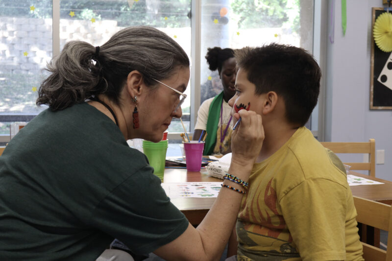 Mirissa Dunne paints King P.'s, 6, face at the Teen FanFest at the Canyon Country Jo Anne Darcy Library in Canyon Country, Calif., Friday, Oct. 9, 2026. Kamryn Martell/The Signal