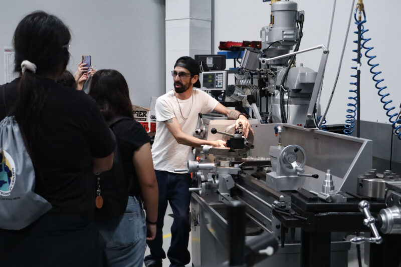 Brennan Meyer, student lab tech for welding and manufacturing department at College of the Canyons, shows a demonstration at COC's fourth annual Manufacturing Day at a facility in Santa Clarita, Calif., Friday, Oct. 9, 2026. Kamryn Martell/The Signal