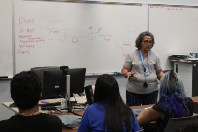 Harriet Happel, dean of Career Education-Integrative Learning and the Employment Center at College of the Canyons, greets new students at COC's fourth annual Manufacturing Day at a facility in Santa Clarita, Calif., Friday, Oct. 9, 2026. Kamryn Martell/The Signal