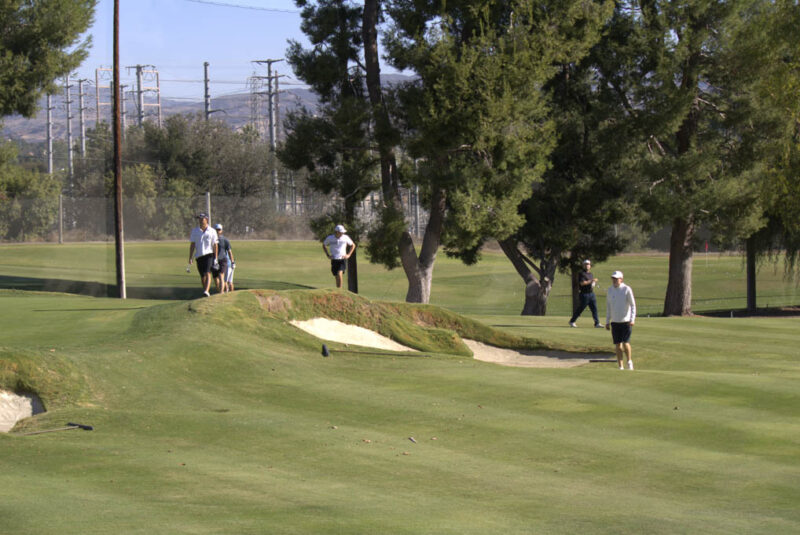 Attendees searching for their ball at the Valencia Country Club in Valencia, Calif., Thursday, Oct, 19, 2026. Audrey De Laura/The Signal