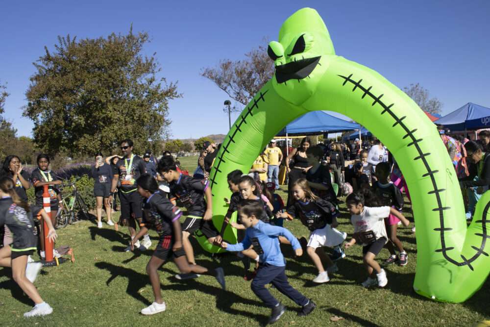 Racers start for the Kids and Puppy run at Finish the Ride and Finish the Run at West Creek Park in Valencia, Calif., Sunday, Oct 25, 2026. Audrey De Laura/The Signal