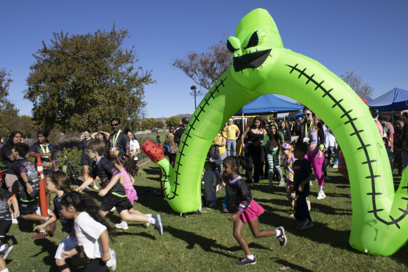 Racers start for the Kids and Puppy run at Finish the Ride and Finish the Run at West Creek Park in Valencia, Calif., Sunday, Oct 25, 2026. Audrey De Laura/The Signal