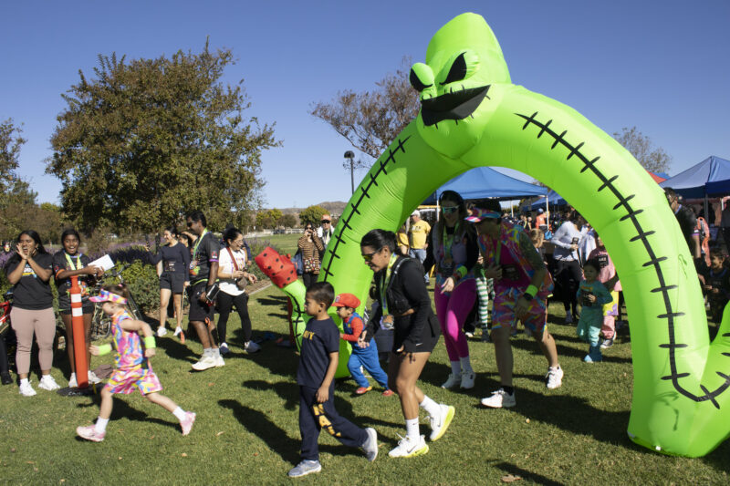 Racers start for the Kids and Puppy run at Finish the Ride and Finish the Run at West Creek Park in Valencia, Calif., Sunday, Oct 25, 2026. Audrey De Laura/The Signal