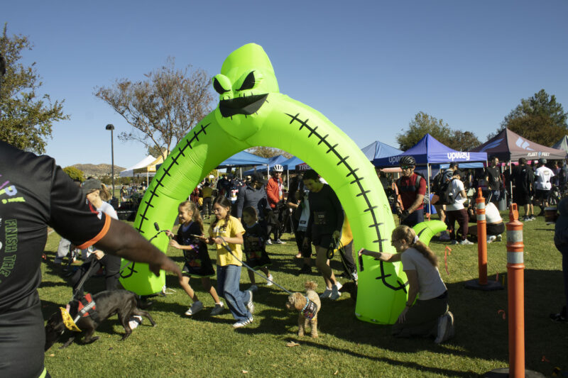 Racers start for the Kids and Puppy run at Finish the Ride and Finish the Run at West Creek Park in Valencia, Calif., Sunday, Oct 25, 2026. Audrey De Laura/The Signal