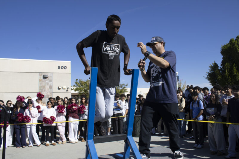 Various students compete in the dipping contest as Petros Papadakis keeps count at West Ranch High School in Valencia, Calif., Wednesday, Oct, 28, 2026. Audrey De Laura/The Signal