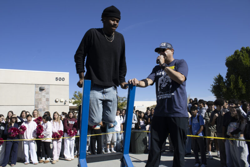 Various students compete in the dipping contest as Petros Papadakis keeps count at West Ranch High School in Valencia, Calif., Wednesday, Oct, 28, 2026. Audrey De Laura/The Signal