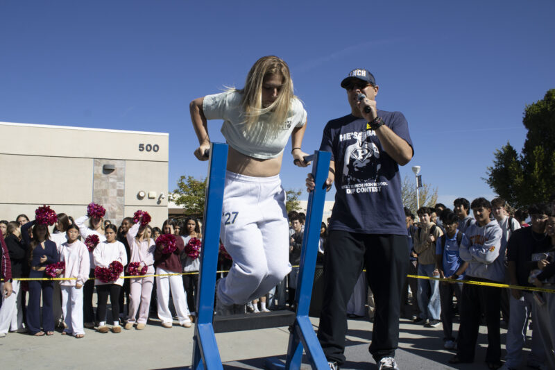 Various students compete in the dipping contest as Petros Papadakis keeps count at West Ranch High School in Valencia, Calif., Wednesday, Oct, 28, 2026. Audrey De Laura/The Signal