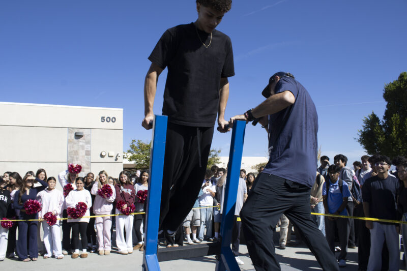 Various students compete in the dipping contest as Petros Papadakis keeps count at West Ranch High School in Valencia, Calif., Wednesday, Oct, 28, 2026. Audrey De Laura/The Signal