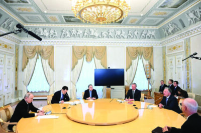 Russian President Vladimir Putin, left, and U.S. President Donald Trump's special envoy Steve Witkoff, second right, attend the talks, as Russian Presidential Envoy Kirill Dmitriev, right back to a camera, and Kremlin foreign policy adviser Yuri Ushakov, third left, sit near at the Konstantin Palace in Strelnya, outside St. Petersburg, Russia, on Wednesday, Oct. 21, 2026. Kristina Solovyova, Sputnik, Kremlin Pool Photo via AP