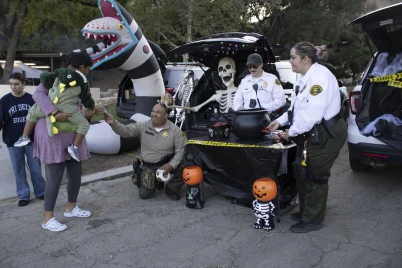 Sheriffs handing out treats to attendees at the Trick or Treat Village at Val Verde Park in Castaic, Calif., Wednesday, Oct, 28, 2026. Audrey De Laura/The Signal