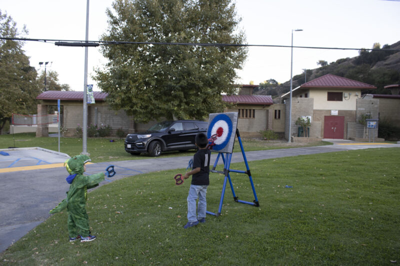 Attendees axe throwing at the Trick or Treat Village at Val Verde Park in Castaic, Calif., Wednesday, Oct, 28, 2026. Audrey De Laura/The Signal